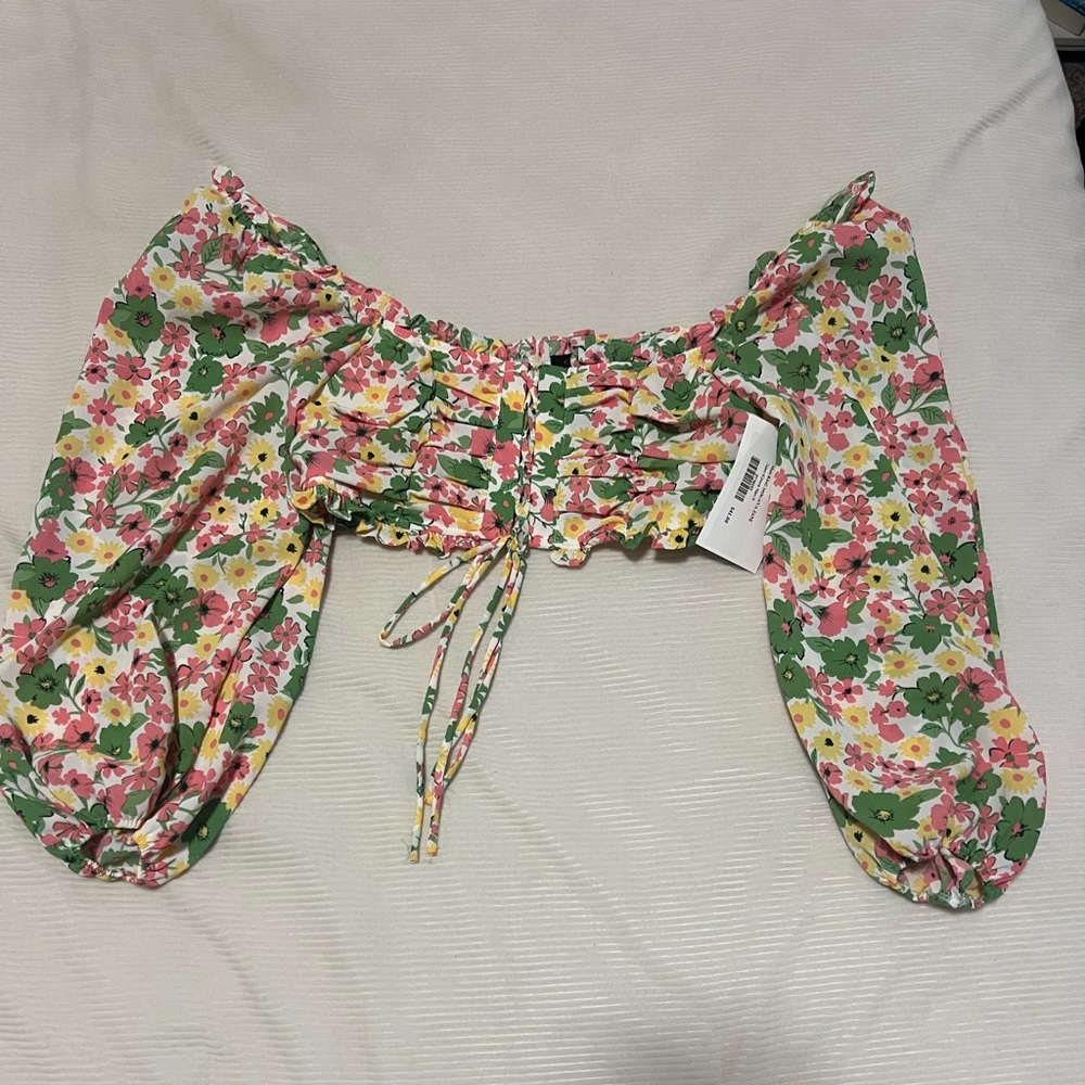 Front tie long-sleeve cropped top. Green, pink, and yellow florals